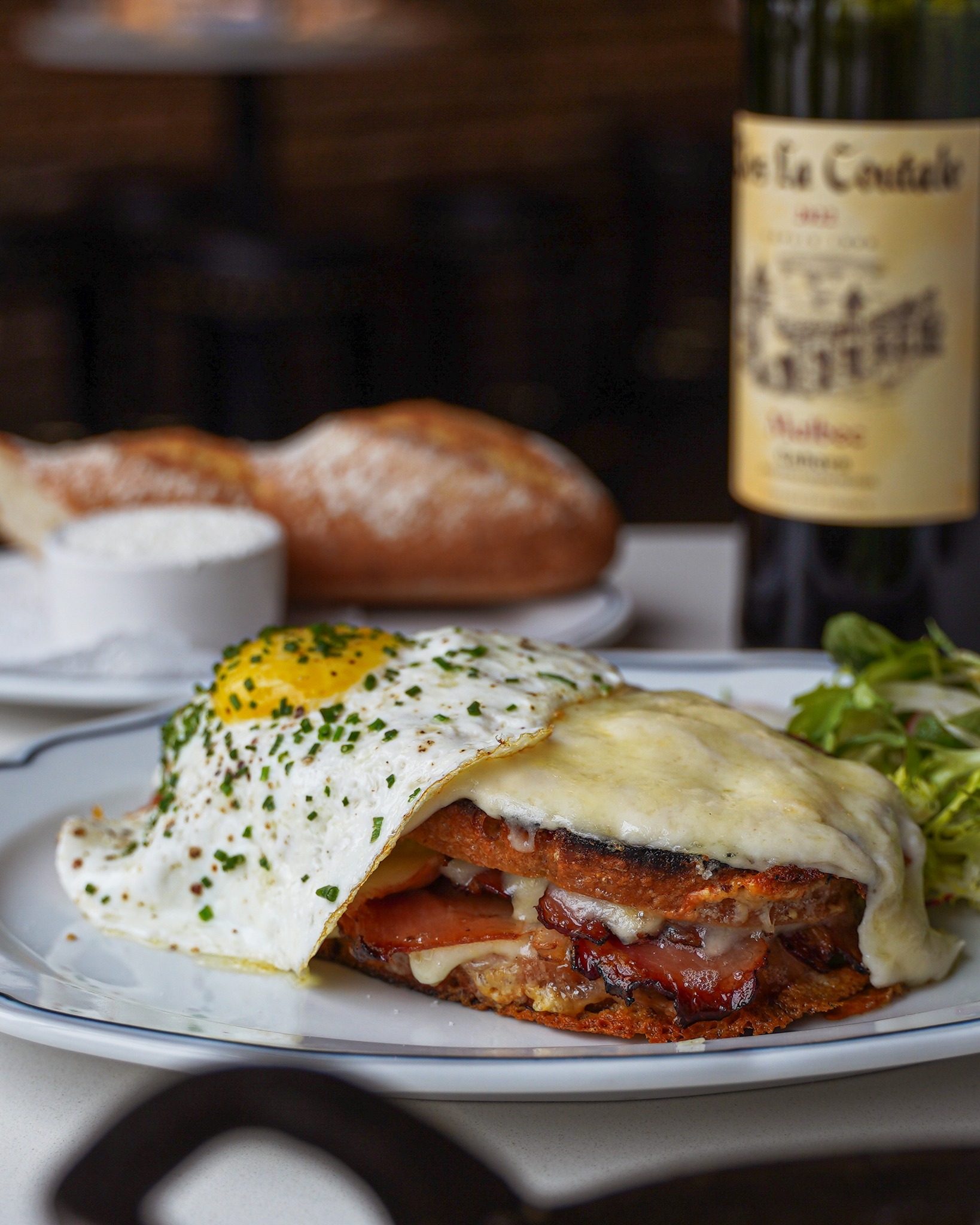 The Croque Madame at Augie’s French is a true team effort. 🥪✨ Fresh sourdough from @grossmansnoshery, house-cured jambon from @starksteakandseafood, creamy Mornay, a touch of Dijon, and the perfect fried egg to top it all off. 🥖🍳 C'est magnifique, non?